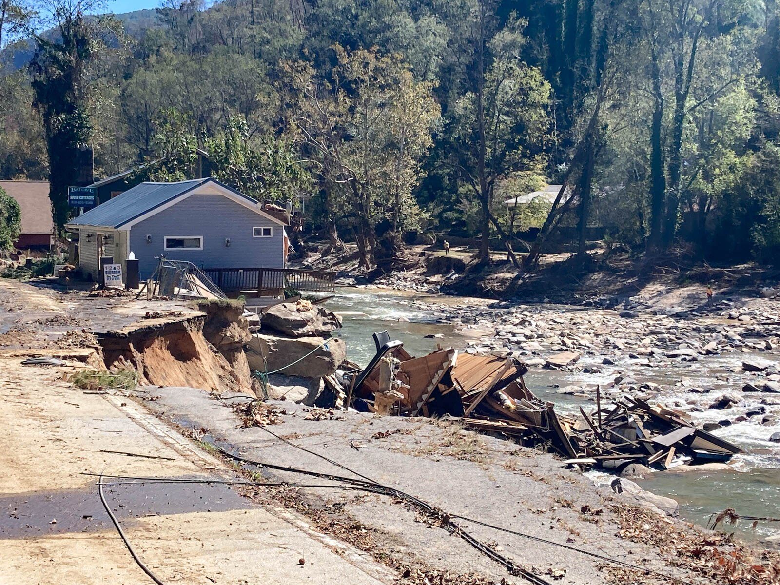 Destroyed road and debris in Bat Cave, North Carolina, after Hurricane Helene floodwaters receded